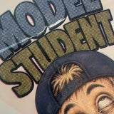 Model Student supersized decal print lettering and cap close-up